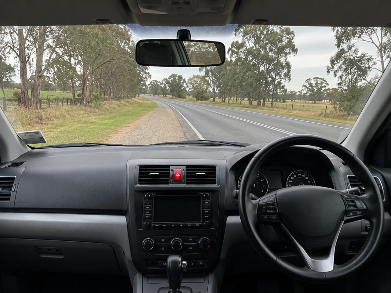 How should you leave a broken-down vehicle when traffic is passing nearby?