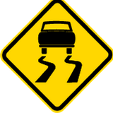 Warnung vor rutschiger Fahrbahn.