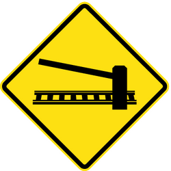 Warning for a railway crossing with barriers.