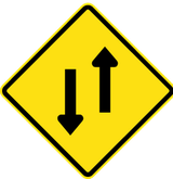 Warning for a road with two-way traffic.