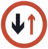 Road narrowing, give way to oncoming drivers.