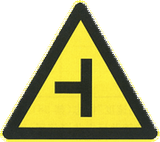 Warning for a side road from the left.