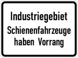 Industrial area, give way to rail vehicles.
