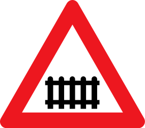 Warning for a railway crossing with barriers.