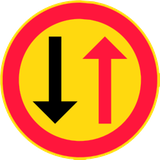 Road narrowing, give way to oncoming drivers.