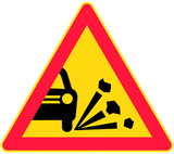 Warning for loose chippings on the road surface.