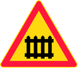 Warning for a railway crossing with barriers.