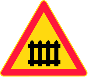 Warning for a railway crossing with barriers.