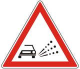 Warning for loose chippings on the road surface.