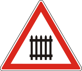 Warning for a railway crossing with barriers.