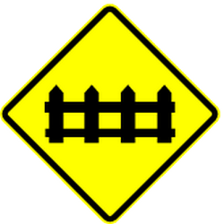 Warning for a railway crossing with barriers.