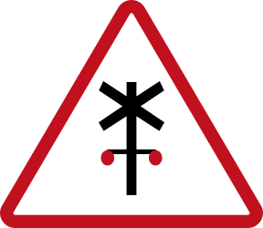 Warning for a railway crossing with barriers.