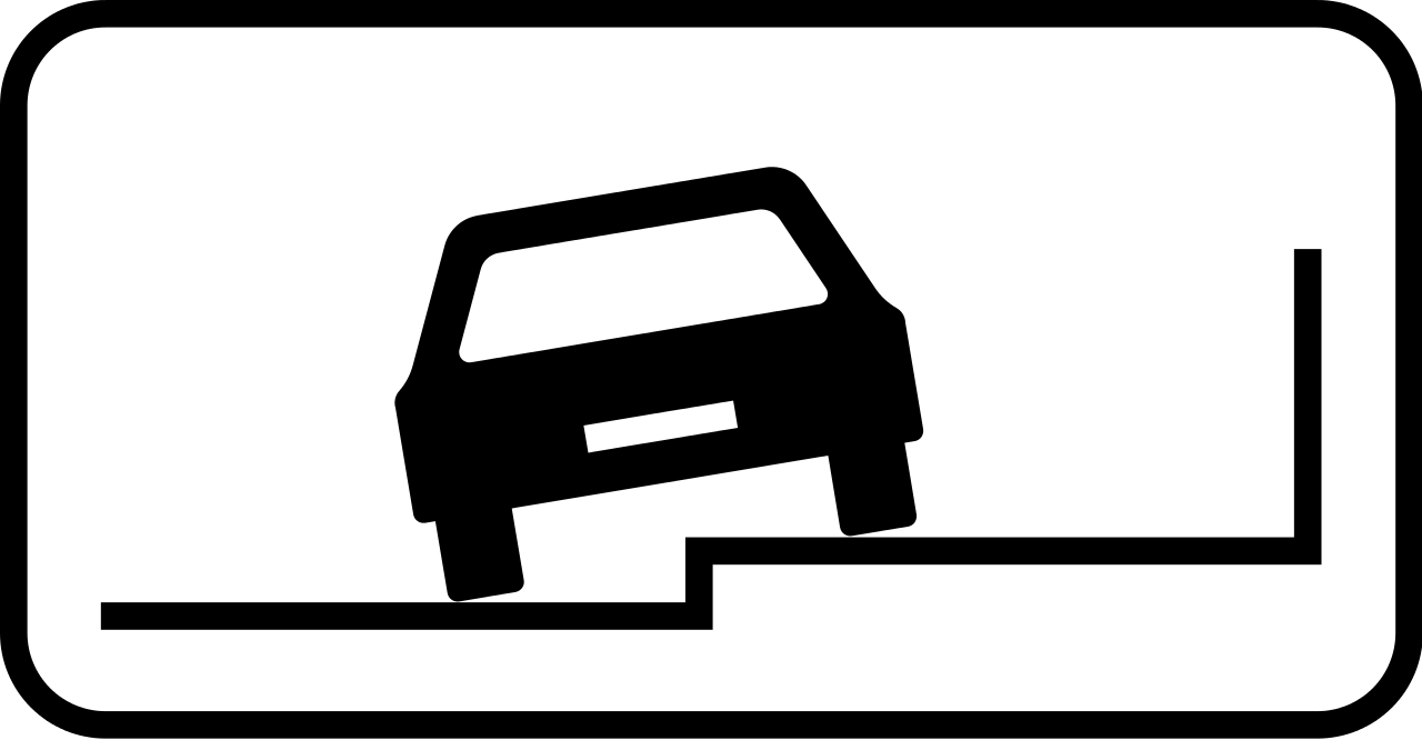 Parallel parking partially on pavement.
