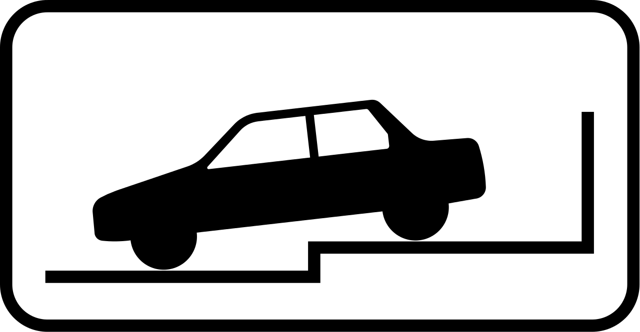 Perpendicular parking partially on pavement.