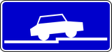 Perpendicular parking partially on pavement.