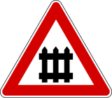 Warning for a railway crossing with barriers.