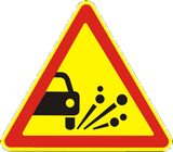 Warning for loose chippings on the road surface.