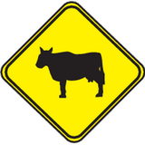 Advertencia de ganado en la calzada.