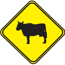 Advertencia de ganado en la calzada.
