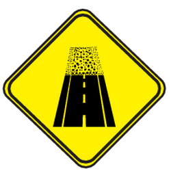 Advertencia de calzada sin pavimentar.
